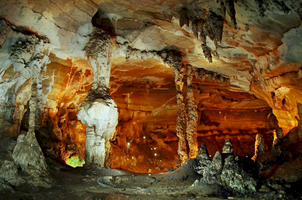 Tien Son Cave captivates travelers with its remarkable stalactites and stalagmites shaped by nature into stunning, artistic forms